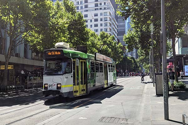 A tram travelling through inner city Melbourne, Victoria.