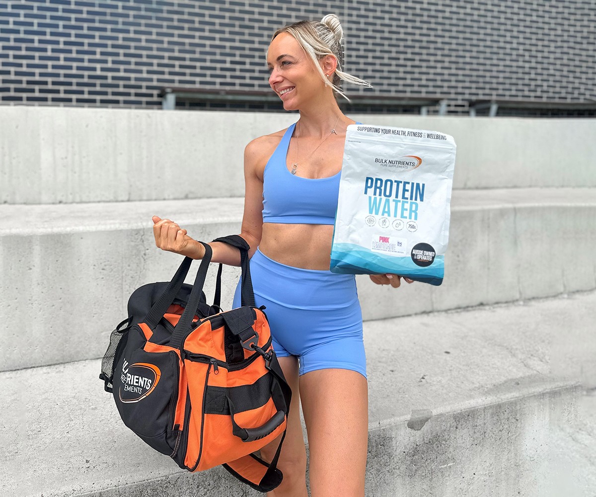 Bulk Nutrients Ambassadors Kylie Gilbert with Bulk Bag and Protein Water