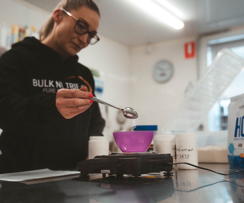 Lab testing a batch of protein powder