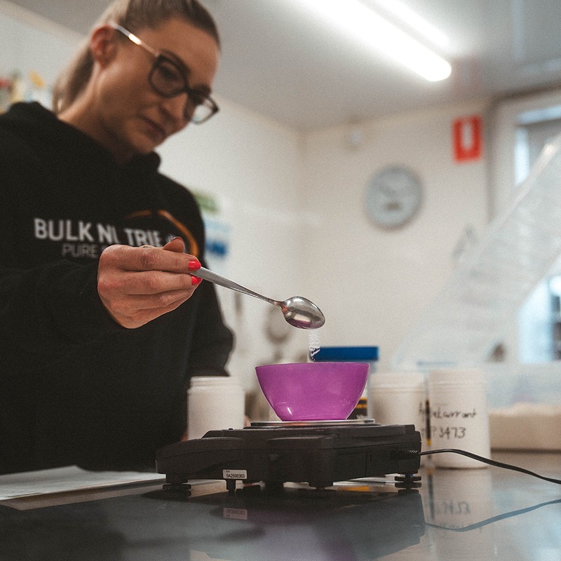 Lab testing a batch of protein powder