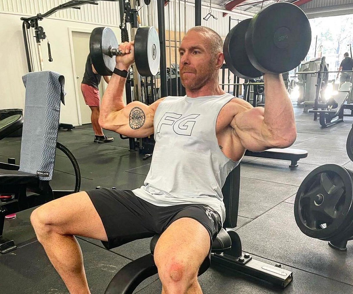 BN Ambassador Bobby Dee in the gym with big weights