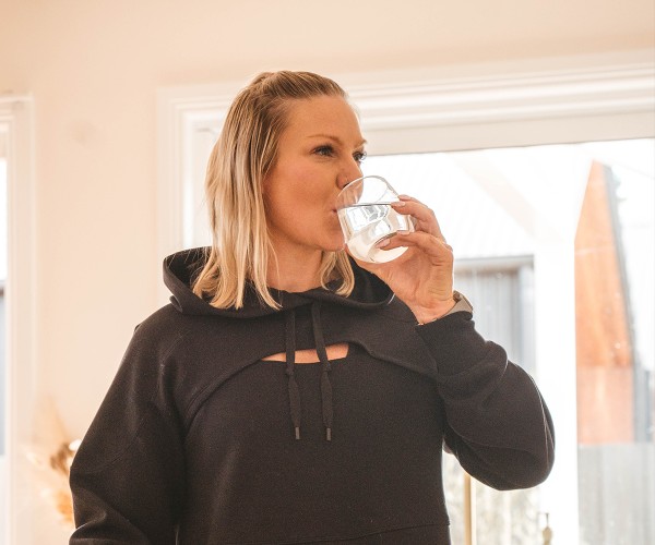 Bulk Nutrients Ambassadors Louise Calvert drink a glass of water