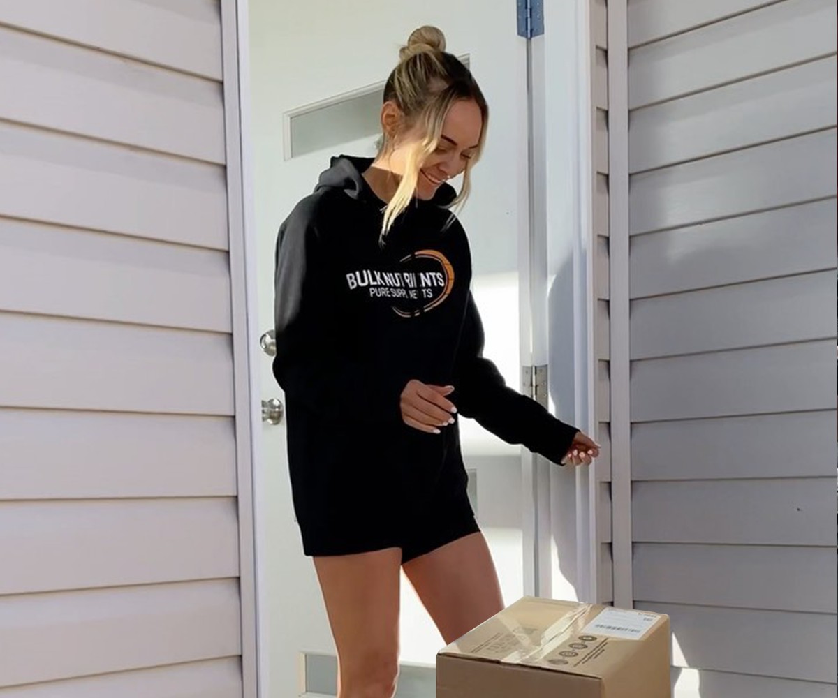 Bulk Nutrients Ambassador Kylie Gilbert with a Bulk Nutrients package