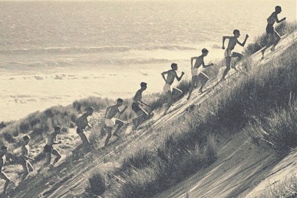 Percy Cerutty leading his athletes up a sand dune in Portsea.