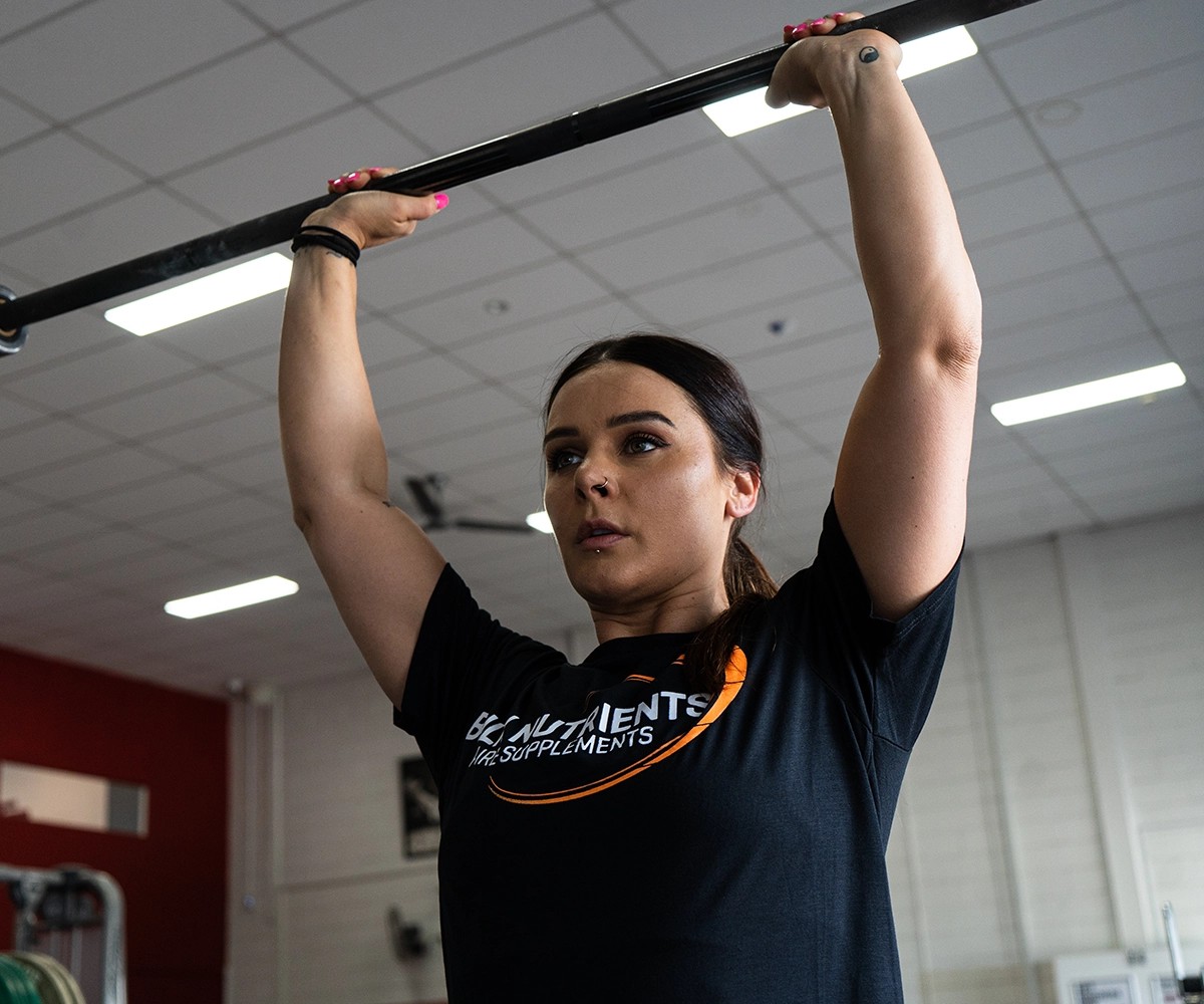 BN Ambassador Ellena Tsatsos lifting a bar above her head