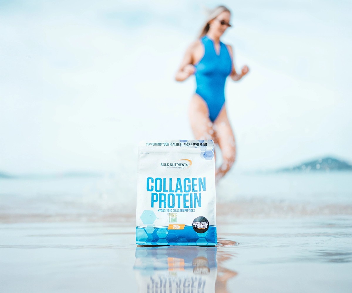 Bulk Nutrients Ambassador Chelsea Reid on the beach with Collagen Protein