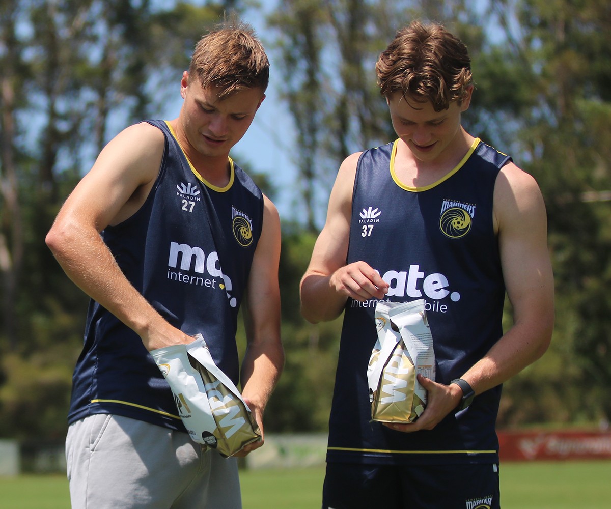 Bulk Nutrients Central Coast Mariners Partnership Announcement Two Players with open bags of WPI