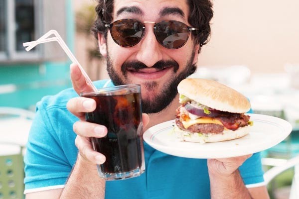 An easy way to cut out excess calories is by making smart choices such as still enjoying burger night with friends but opting for a Coke No Sugar over a milkshake.