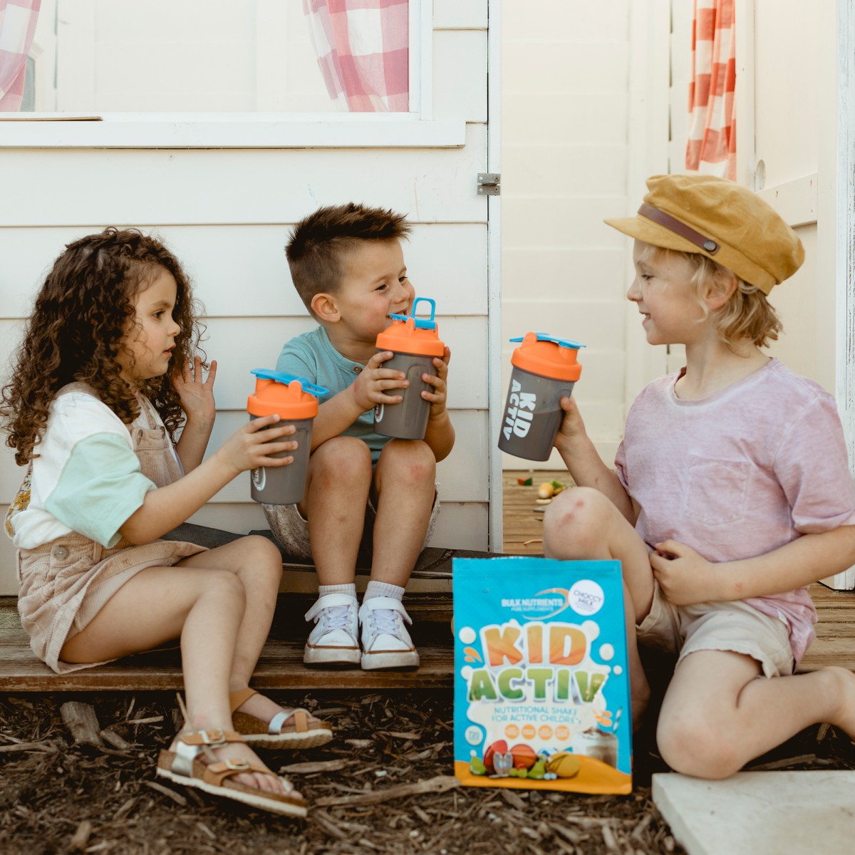 Three kids trying Bulk Nutrients KidActiv in the play ground