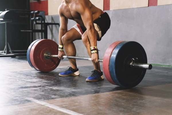 Man performing a deadlift in the gym.
