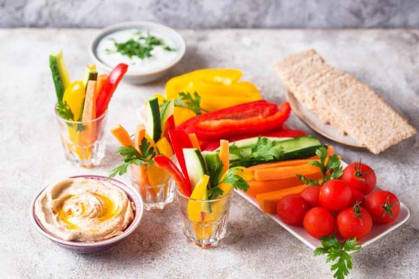 Snack on low-calorie dips and veggie sticks