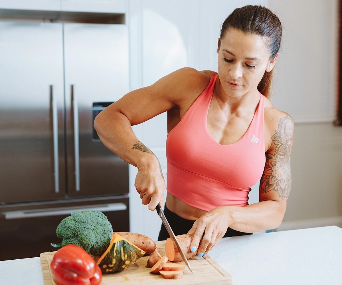 Bulk Nutrients Ambassador Tammie Sarkozy cropping vegetables on a table