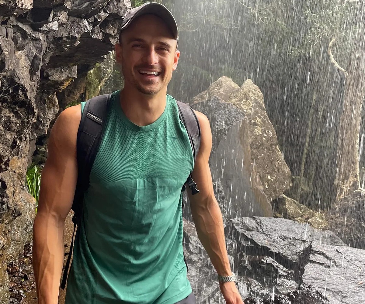 Ambassador Max Cuneo walking near a waterfall
