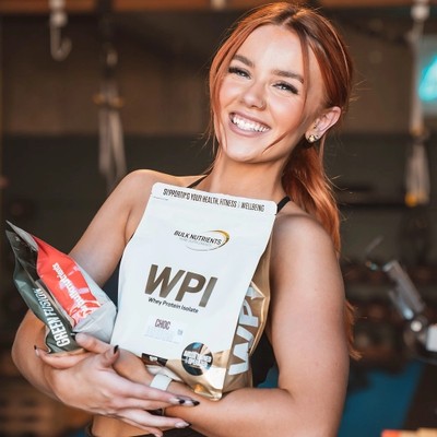 Bulk Nutrients Ambassador Emily Westgarth with a bag of Whey Protein Isolate