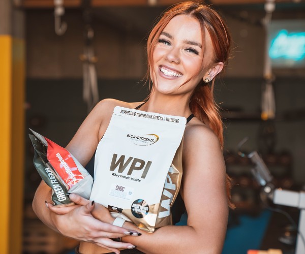 Bulk Nutrients Ambassador Emily Westgarth with a bag of Whey Protein Isolate
