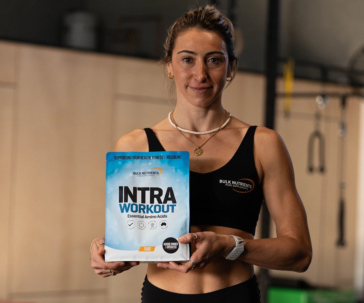 Bulk Ambassador Nicola holding Bulk Nutrient's Intra Workout. A refreshing way to take protein... Intra Workout is 100% plant based free form amino acids and available in four great flavours (Berry, Cola, Pineapple, Lemonade and Mango & Passionfruit!). Available in 750g pouches.