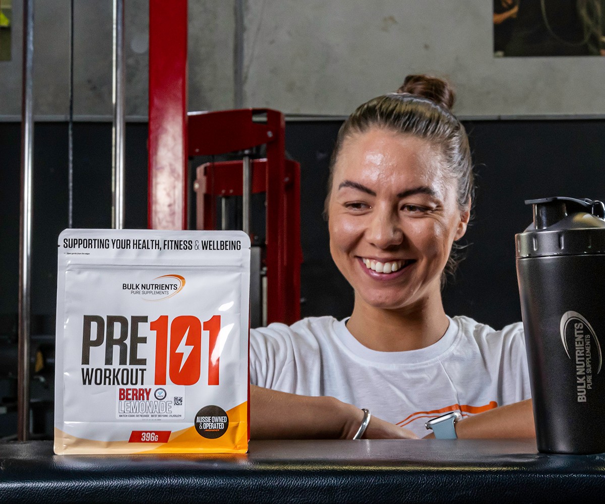 Bulk Nutrients Ambassador Bailey McDougall with bag of Pre Workout 101
