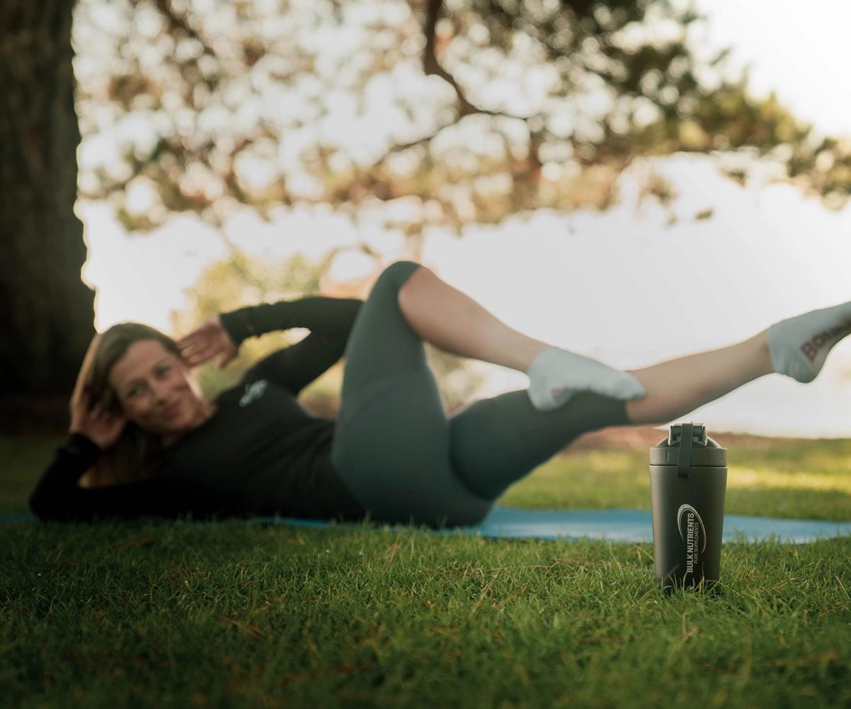 Nicole Frain doing an exercises on her back