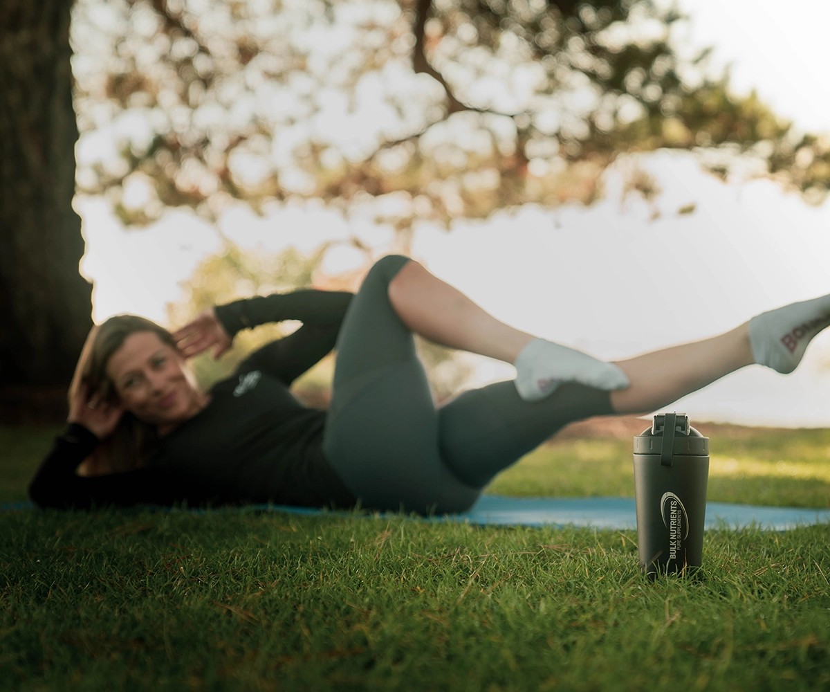 Nicole Frain doing an exercises on her back
