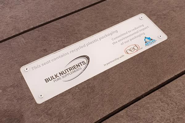 A replas table made from recycled packaging sits proudle in Bulk Nutrients' outdoor lunch area