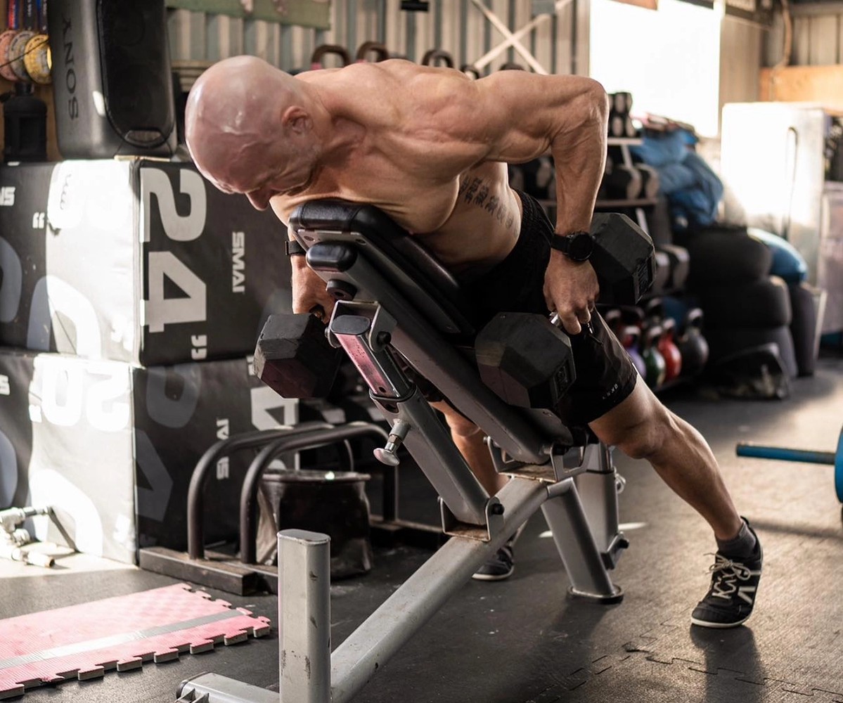 Bulk Nutrients Ambassador Bobby Dee pulling weights on a bench