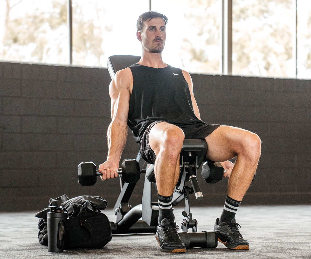 Ryan in the gym with weights