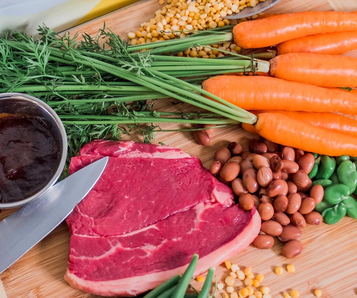 Protein meat and vegetables on chopping board