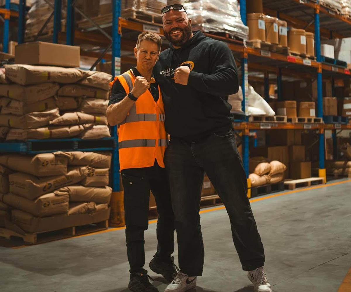 BN Ambassador Macauley Tinker at Bulk Nutrients warehouse with Ben