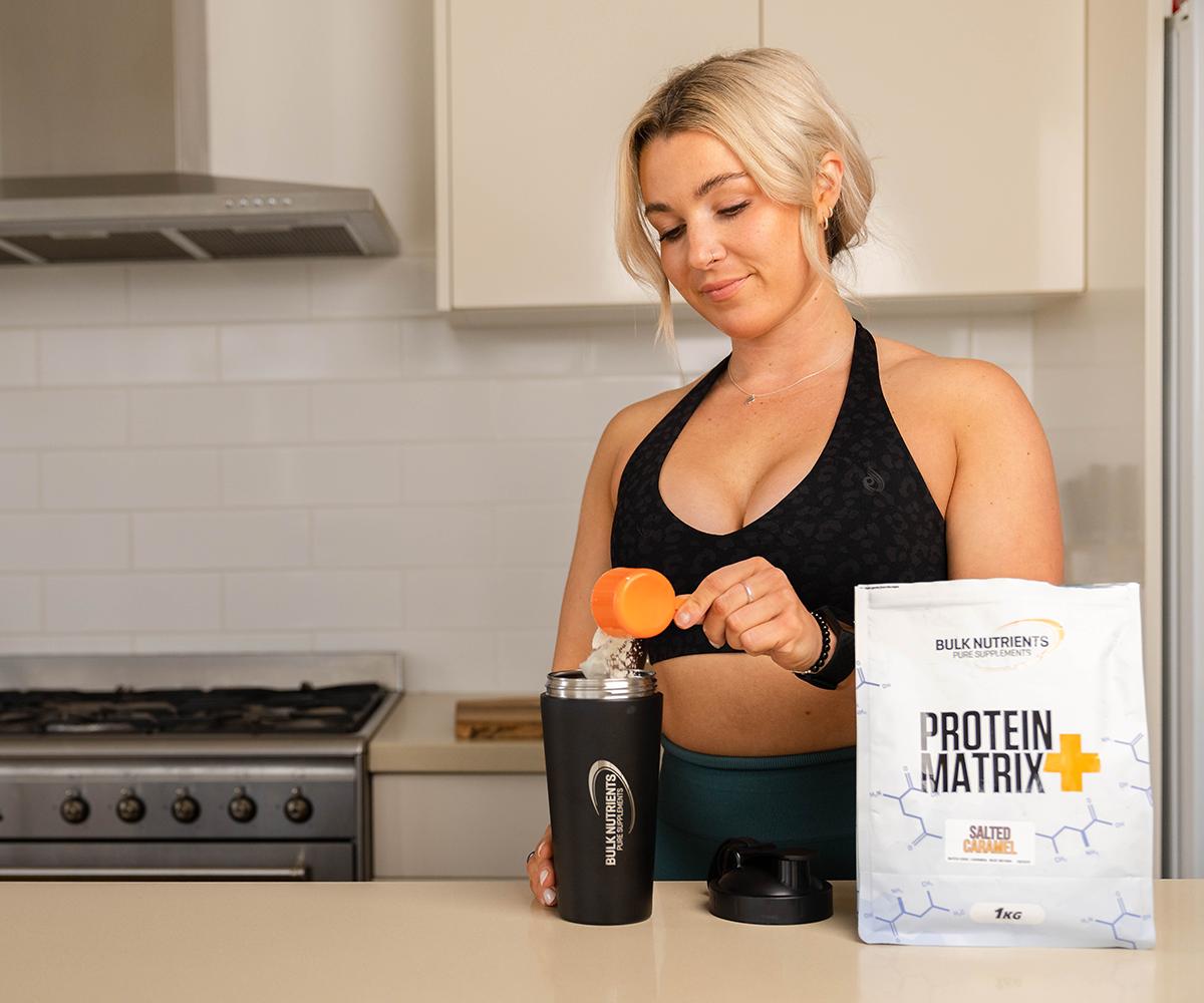 Bulk Nutrients Ambassador Talia Smith with a bag of Protein Matrix+