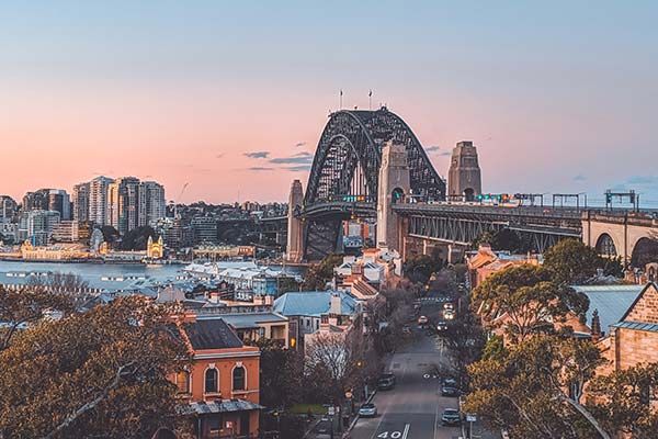 The sunsetting over the Sydney Harbour Bridge in Sydney, New South Wales.