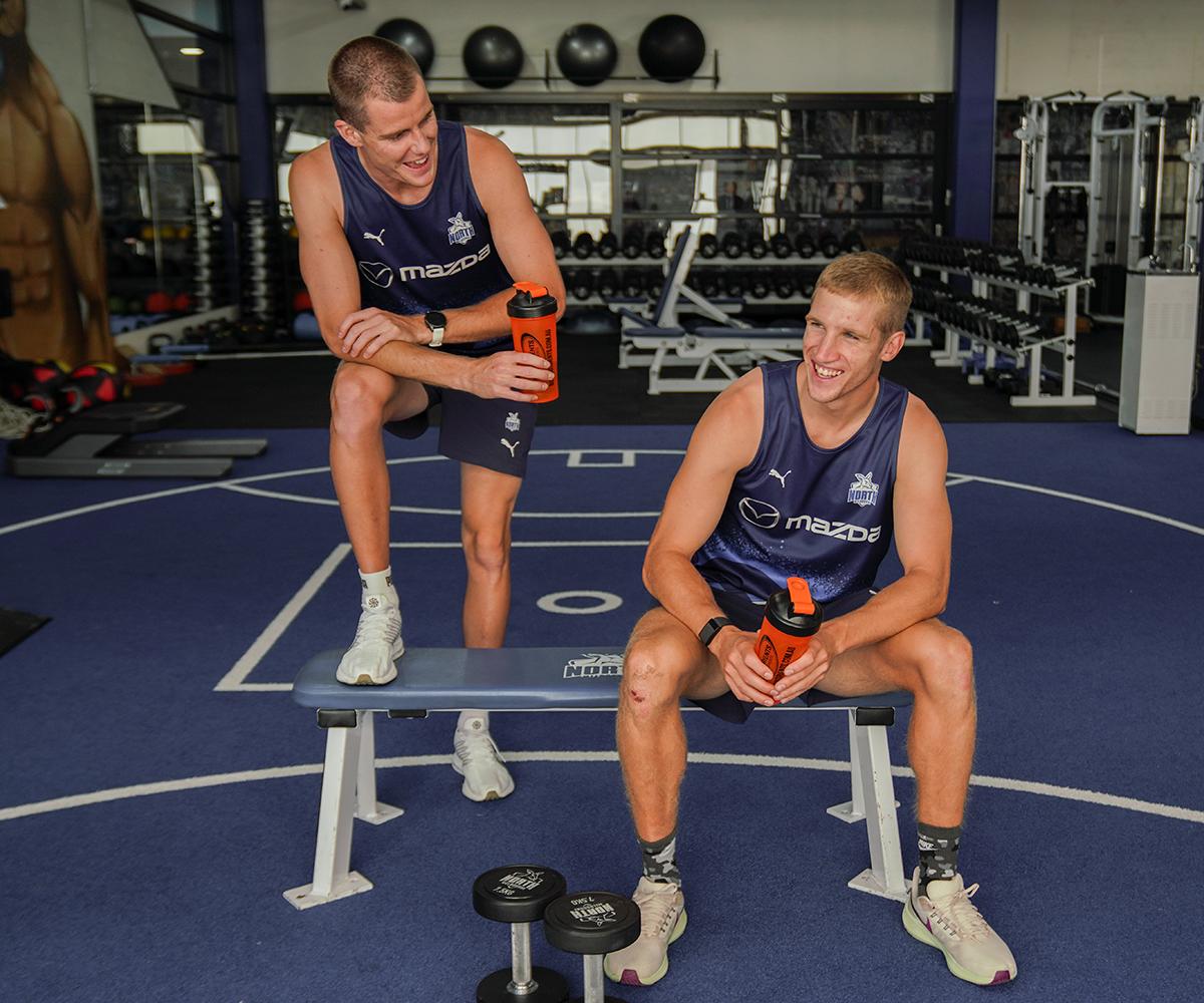 Bulk Nutrients x North Melbourne Football Club Partnership Player drinking from Bulk Shakers in the Gym
