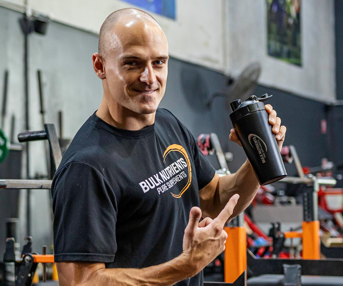 Bulk Nutrients Ambassador Max Cuneo with a stainless steel shaker.