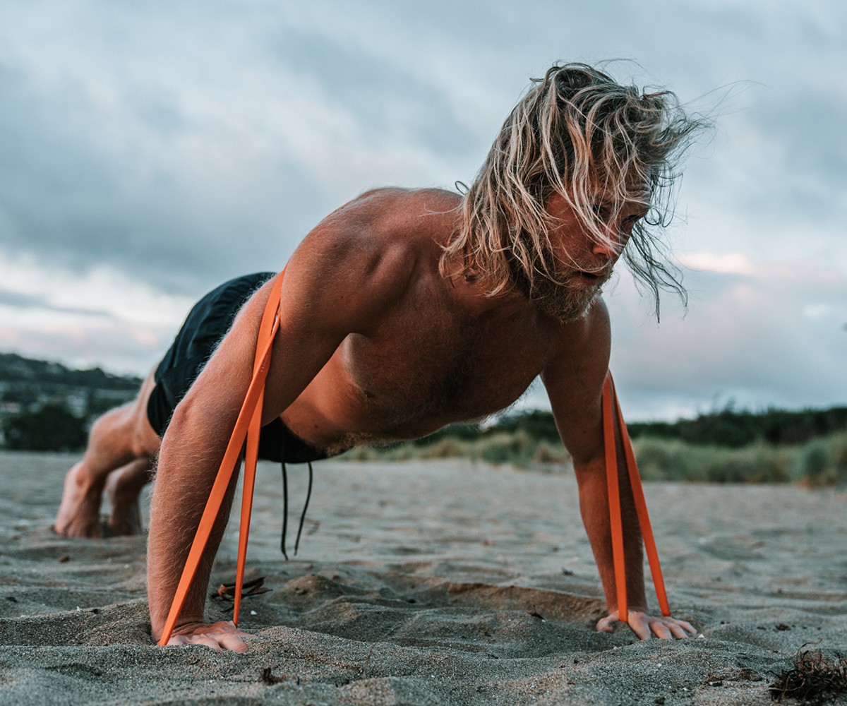 Bulk Nutrients Ambassador Andy Leigh doing pushup with resistance band