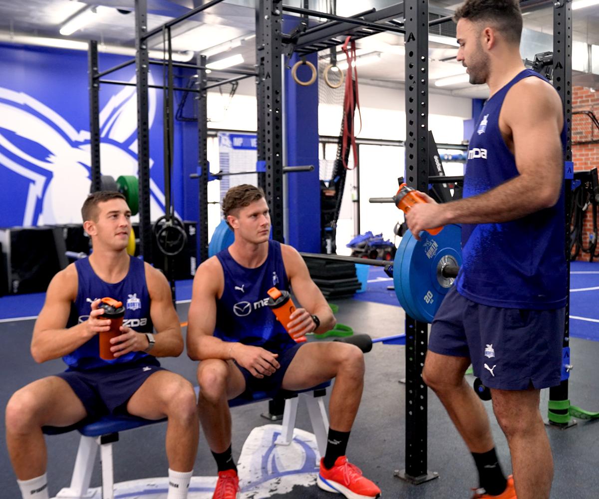 NMFC Players with a Bulk Nutrients Shaker in a gym