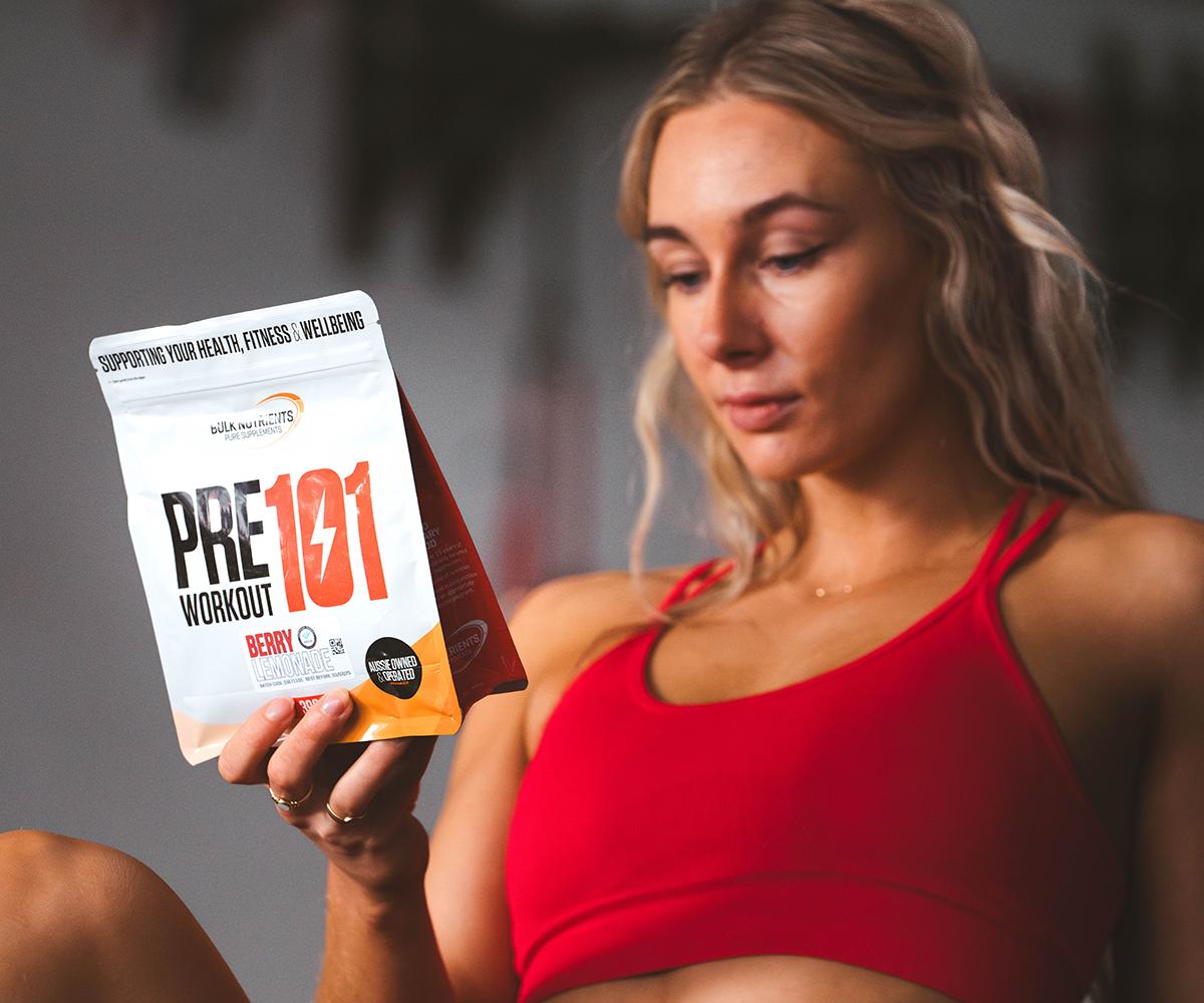Bulk Ambassadors Lindsay Perry and Sam Brereton holding a 396g pouch of Bulk Nutrient's Pre Workout 101. Certified to crush workouts, Pre Workout 101 offers sustained energy, more focus and no crash. Available in 396g pouches and in a range of great flavours.