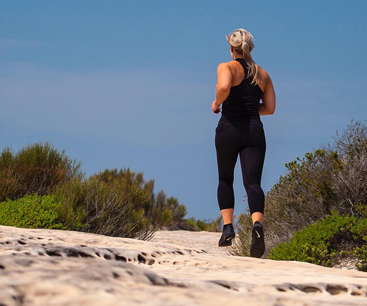 A woman running along a track