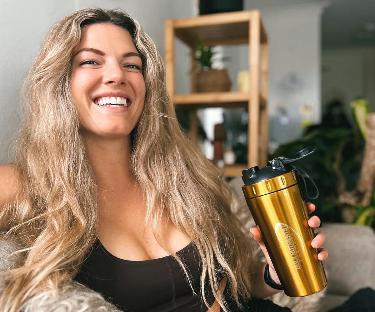 Bulk Nutrients Ambassador Gabrielle Keaton with a gold shaker