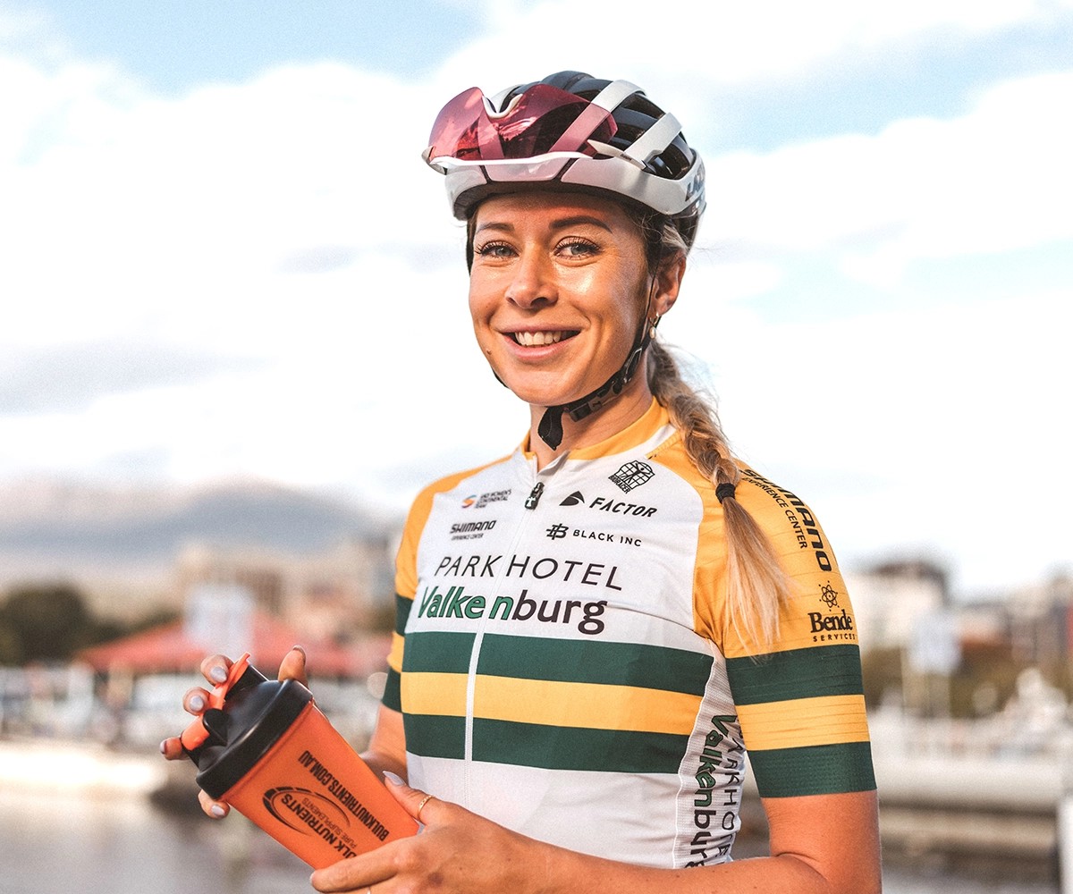 Bulk Ambassador Nicole Frain holding shaker with SportsFuel 101