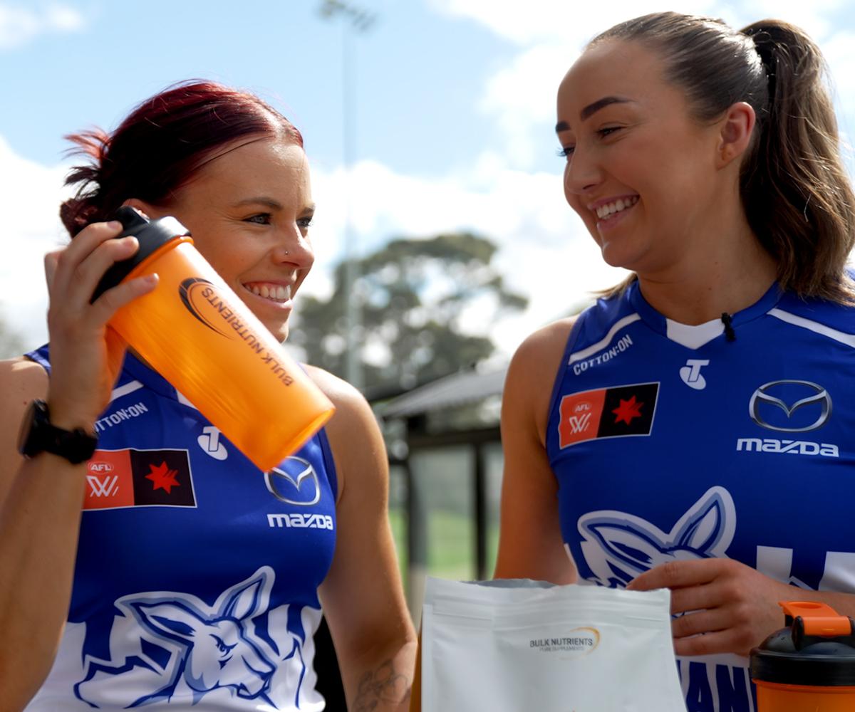Two North Melbourne FC Players with Bulk Nutrients Shakers