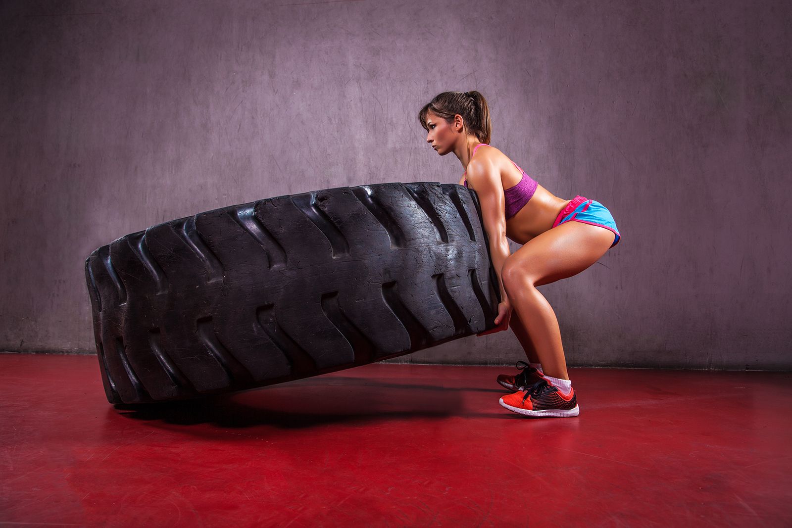 Woman-lifting-tire