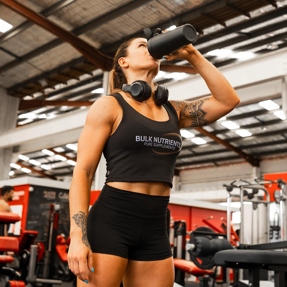 Bulk Nutrients Ambassador Tammie Sarkozy drinking from a black shaker