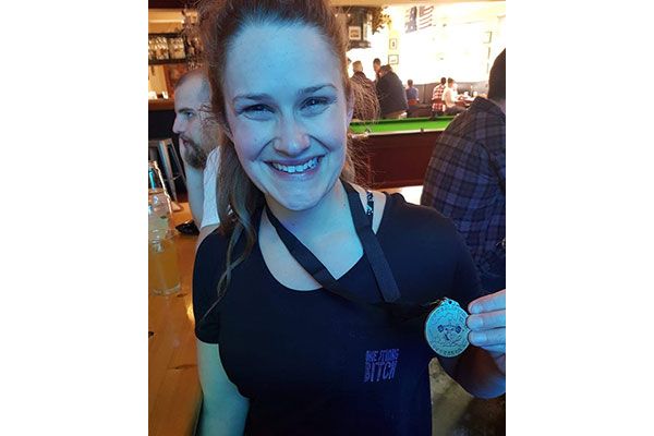 Grinning from ear to ear with my first ever medal.