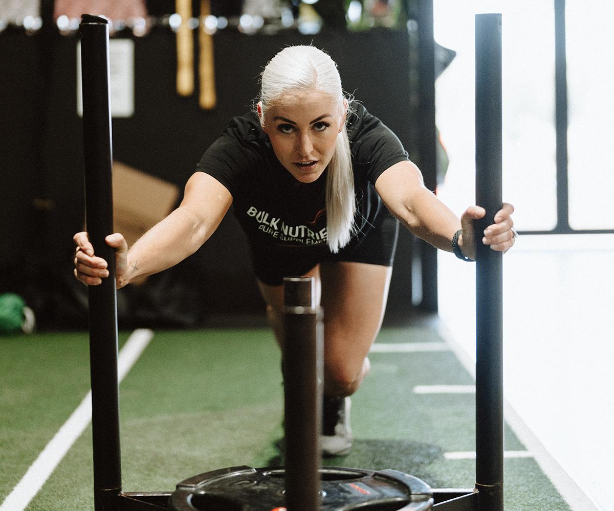 Bulk Nutrients Ambassadors Tarran Lee pushing the sled