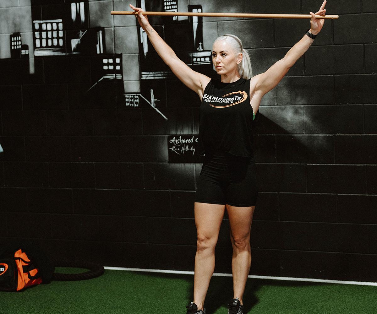 Bulk Nutrients Ambassadors Tarran Lee with wooden pole in the gym
