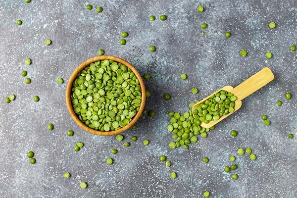Split peas in a brown bowl.