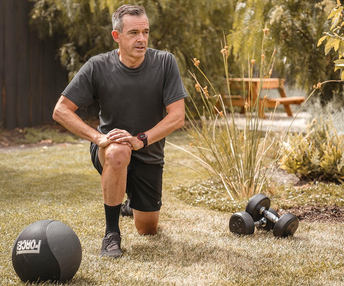 Man stretching in the backyard