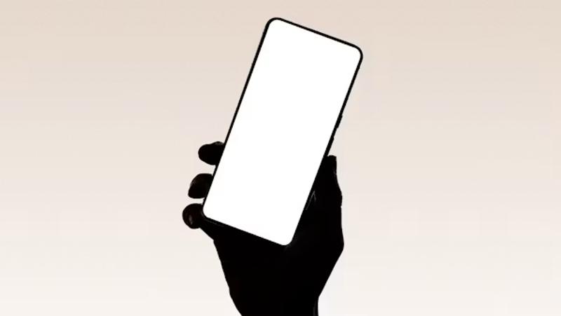 a-hand-holds-up-a-smartphone