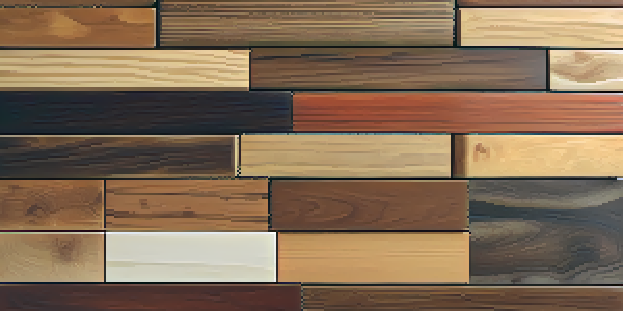 A variety of wood types displayed on a rustic table, showcasing different colors and textures.