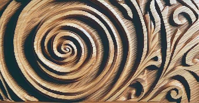 A detailed wooden carving of a spiral symbol with natural lighting and a blurred background.