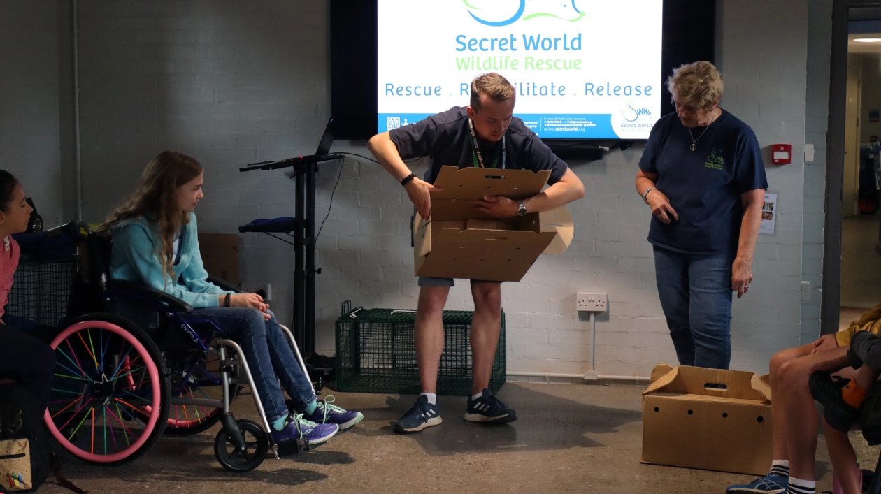 Employees from Secret World Wildlife Rescue demonstrating with a special animal rescue box